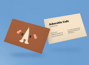 A mockup of a business card for the "Adorable Cafe" with a guinea pig illustration in the front